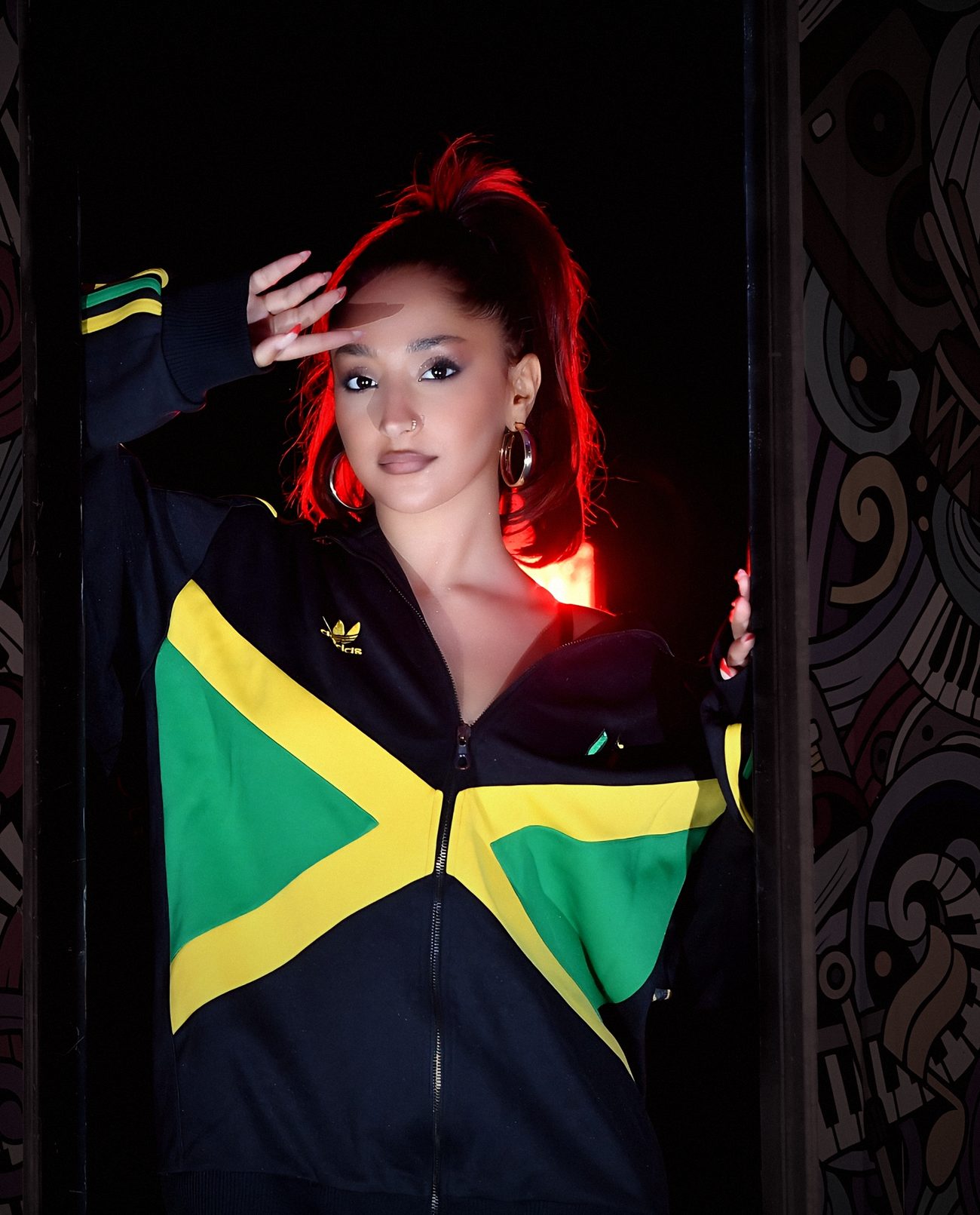 Daniel De Loco in a Jamaica track jacket
