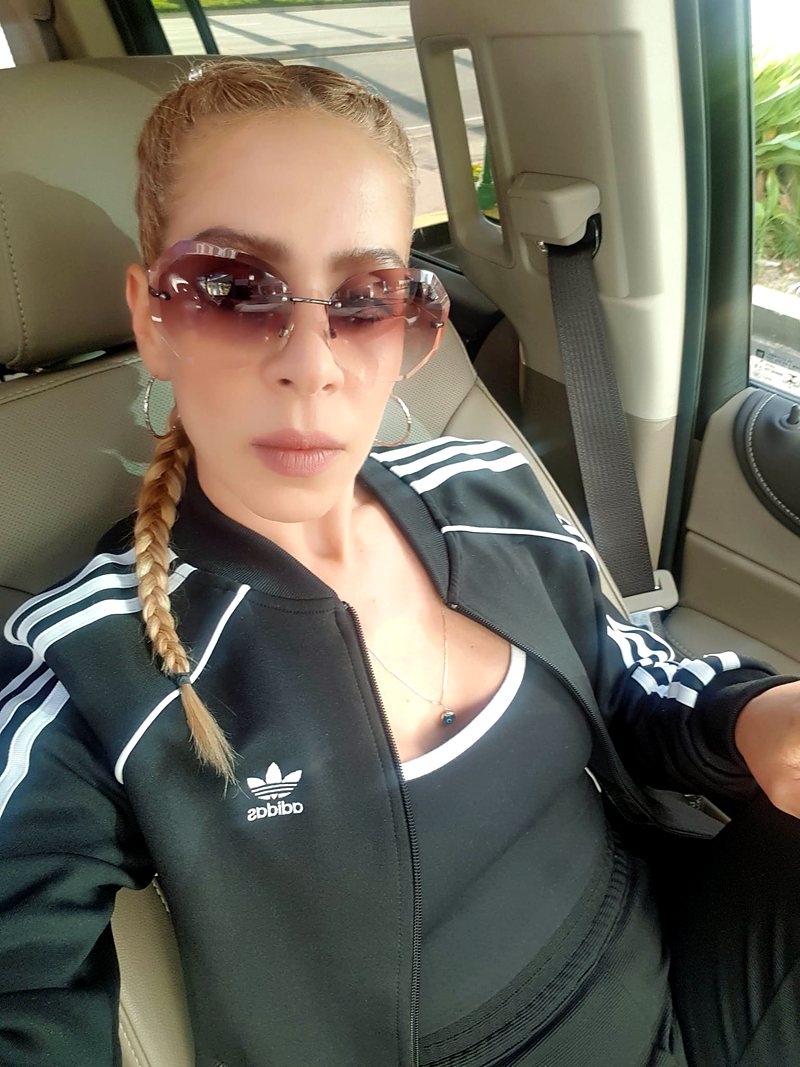 Inbar in sunglasses, on the road
