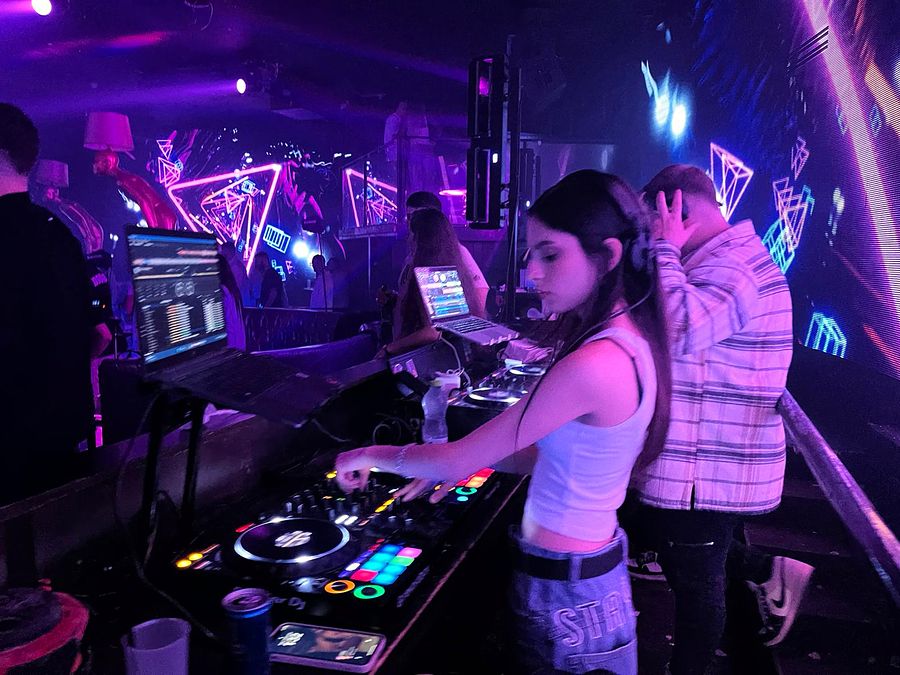 DJ Jaqueline mixing at the club